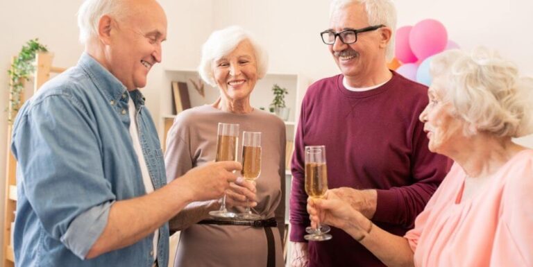Elderly Friends Celebrating With Champagne Toast at Independent Living Facility