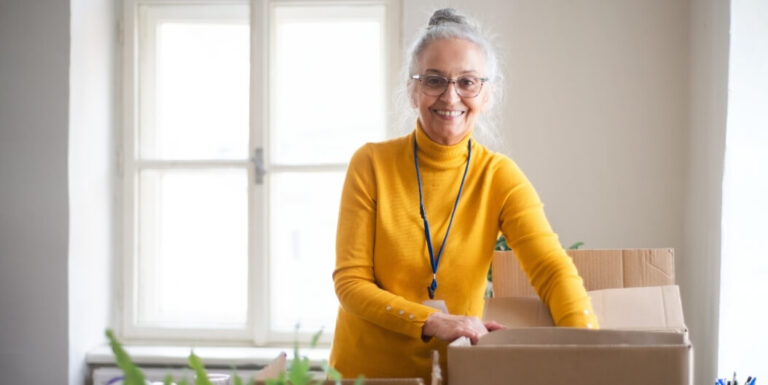 Senior Woman Packing Her Belongings for an Independent Living Facility Move.